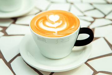 Cup of cappuccino with foam art.