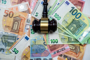 Judge hammer above  euro banknotes money. Bribe concept