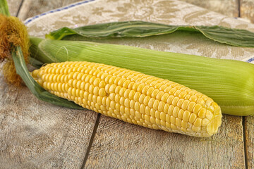 Yellow sweet raw cob corn