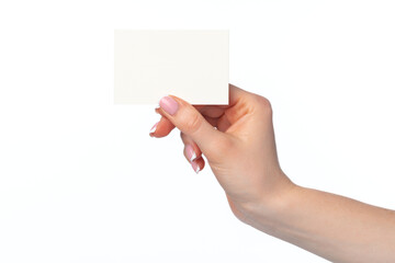 Female hand with blank white business card isolated on white