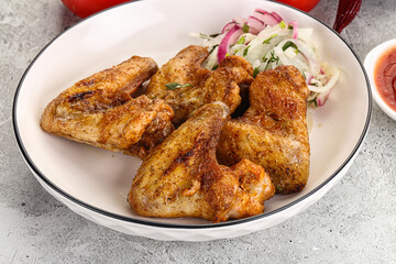 Grilled chicken wings with sauce