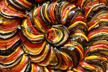 Close up view of traditional tian made of vegetable slices