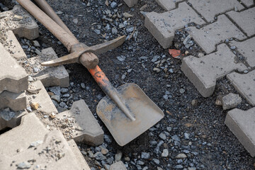 pick and shovel at construction site. Digging work on communication infrastructure