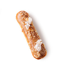 eclair with caramel and nuts on white