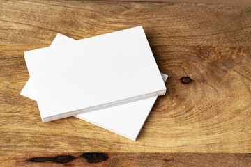 Two piles of blank business cards on table