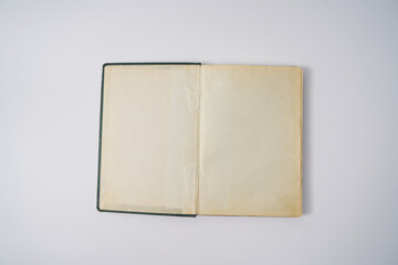 Old dark green notebook from 1950' on a white background.