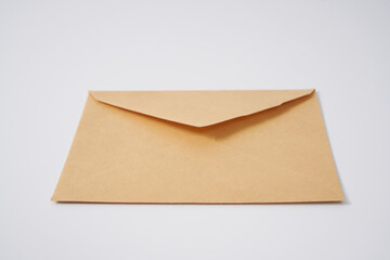 Old brown envelope from 1950' on a white background.