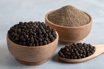 Ground black pepper with grains of black pepper,closeup