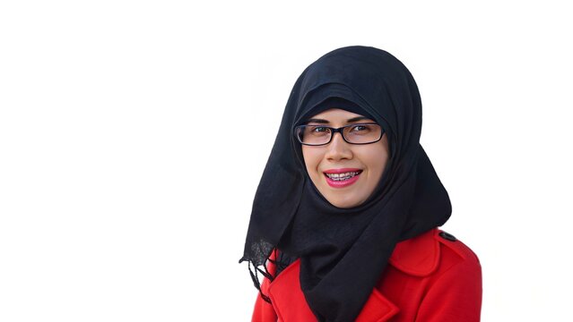 Close up portrait of smiling young Muslim woman wearing black hijab and red jacket. Happy and cheerful expression. 