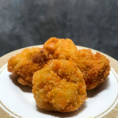 Food menu Crispy flour fried chicken served on a plate.