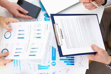 Discussion of business plan at workplace closeup. Joint business project into marketing analytics