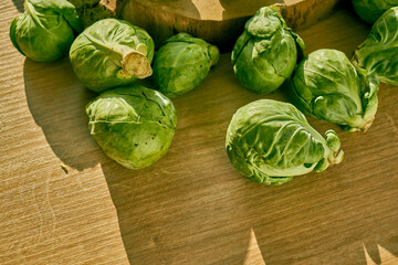 Sliced Brussels sprouts on a wooden kitchen counter.