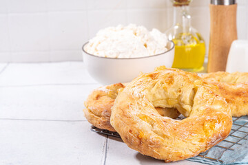 Cottage cheese bagels. Trendy curd cheese baking, bread rings with cottage cheese and parmesan,...