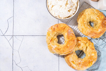Cottage cheese bagels. Trendy curd cheese baking, bread rings with cottage cheese and parmesan,...