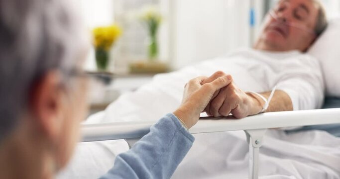 Hospital, bedroom and senior couple holding hands, empathy and support husband recovery, healthcare problem or rehabilitation. Retirement, comfort or elderly woman care for sick cancer patient in bed