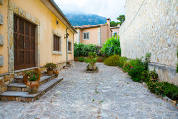 View of a medieval street of the picturesque Spanish-style village Valdemossa in Majorca or Mallorca island, Spain.