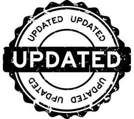 Grunge black updated word round rubber seal stamp on white background