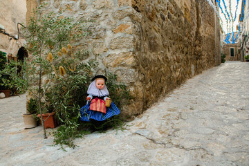 View of a medieval street of the picturesque Spanish-style village Valdemossa in Majorca or Mallorca island, Spain.