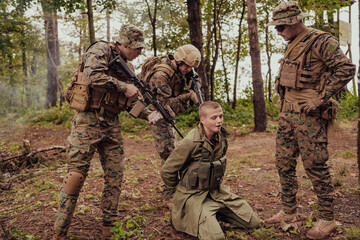 Fototapeta premium Soldiers squad was capture alive terrorist and interrogation them on them on special tactics violent way