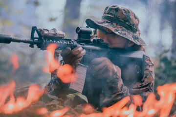 A soldier fights in a warforest area surrounded by fire