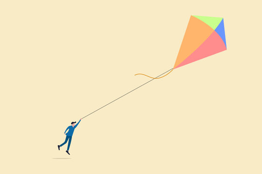 Businessman running after a kite. concept of opportunity, investment, future growth or career development vision, and target