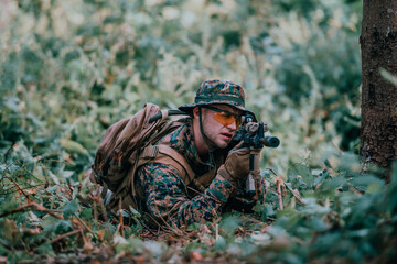 Modern warfare soldier surrounded by fire, fight in dense and dangerous forest areas