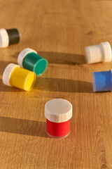 Red, blue, yellow, black, white ,green colored gouache paint ans. Jars of gouache. Paint. Gouache....