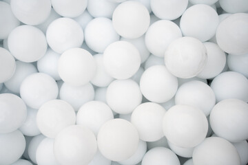 Many white plastic balls for dry pool.