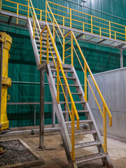 Industrial Interior, metallic colorful staircase with yellow railings