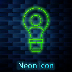 Glowing neon line Human head with lamp bulb icon isolated on brick wall background. Vector