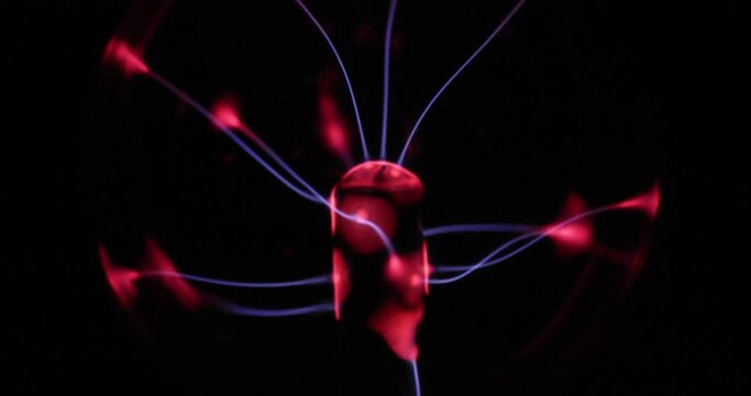 Plasma Globe or Lamp close-up in slow motion showing tendrils of plasmid.