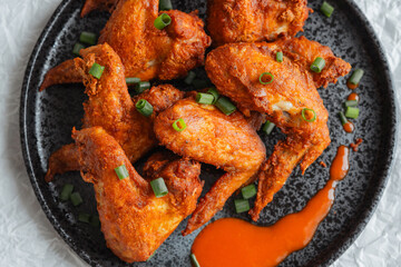 Crispy Fried Chicken Wings Topped with Green Onions