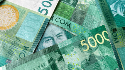 Eyes Kyrgyz Soviet actor Suymenkula Chokmorova. Portrait in a triangle. Kyrgyz banknotes in 5000 SOM. The Kyrgyz national currency is five thousand som.