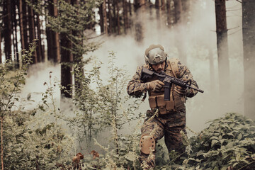 A modern warfare soldier on war duty in dense and dangerous forest areas. Dangerous military rescue...