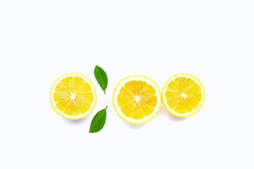 Fresh lemon with green leaves on white. Copy space for text or product