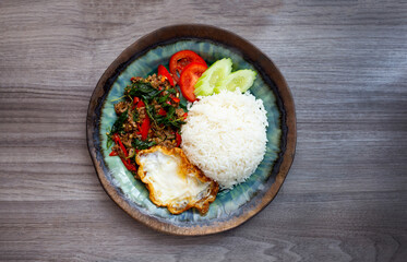 Rice with stir-fried beef and holy basil, fried egg.