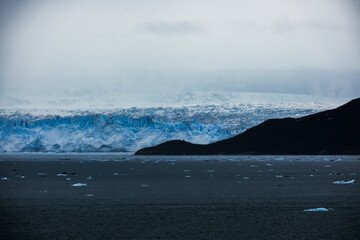 Cruise to Hubbard Glacier Bay in Alaska with floating ice bergs and drift ice floes on ocean water...