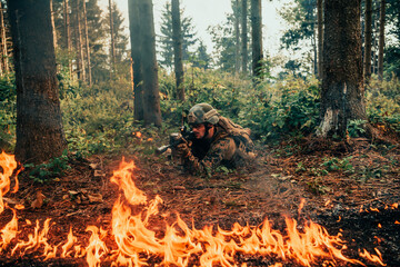 Modern warfare soldier surrounded by fire, fight in dense and dangerous forest areas