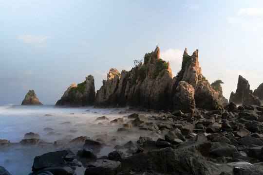 photo of pantai batu layar or pantai gigi hiu at kelumbayan tanggamus lampung, high quality images good for background. long exposure shoot on exotic beach. summer natural rocks corals daylight