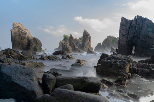 photo of pantai batu layar or pantai gigi hiu at kelumbayan tanggamus lampung, high quality images good for background. long exposure shoot on exotic beach. summer natural rocks corals daylight