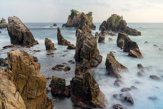 photo of pantai batu layar or pantai gigi hiu at kelumbayan tanggamus lampung, high quality images good for background. long exposure shoot on exotic beach. summer natural rocks corals daylight