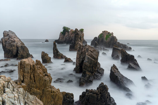 photo of pantai batu layar or pantai gigi hiu at kelumbayan tanggamus lampung, high quality images good for background. long exposure shoot on exotic beach. summer natural rocks corals daylight
