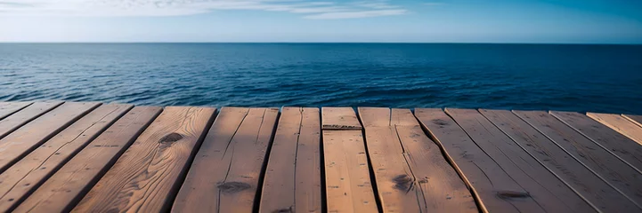 Fotobehang wooden pier on the sea, wood floor, ocean and blue sky © Guddah