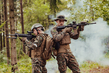 Fototapeta premium Modern Warfare Soldiers Squad Running in Tactical Battle Formation Woman as a Team Leader