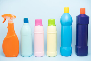 House cleaning plastic product on blue table background, home service or housekeeping concept
