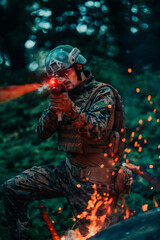 A soldier fights in a warforest area surrounded by fire