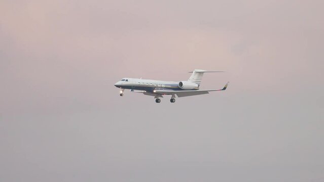 Generic Unmarked Luxury VIP Private Executive Jet Airplane Flying Final Approach over Mountains during Early Morning Evening 