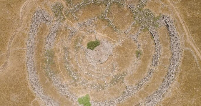 Aerial view of ancient megalithic monument site in the shape of 3 concentric stone circles, Rujum Al-Hiri, Golan Heights, Israel.