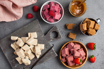 Assorted pieces of organic chocolate with different flavors. 