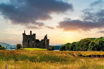 Fototapeta premium Castle, a ruined 15th-century structure on the banks of Loch Awe, in Argyll and Bute, Scotland.